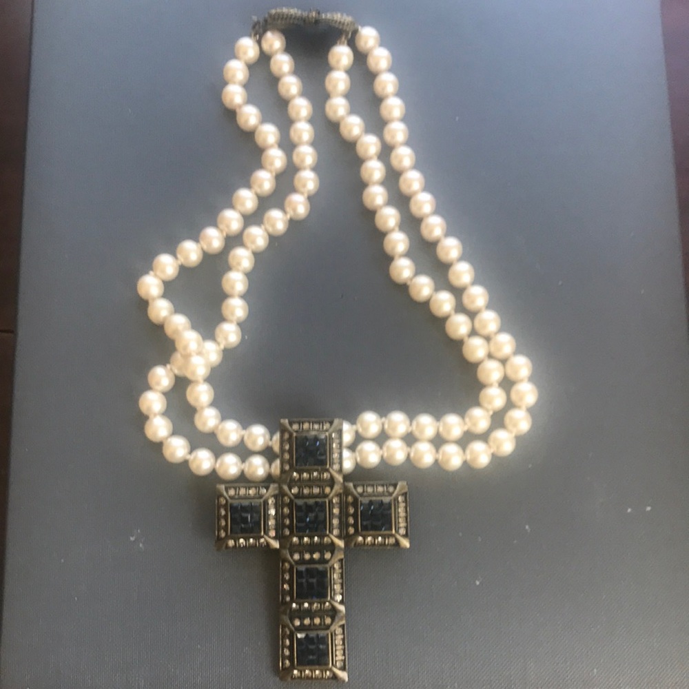 Heidi Daus pearl and rhinestone cross necklace.